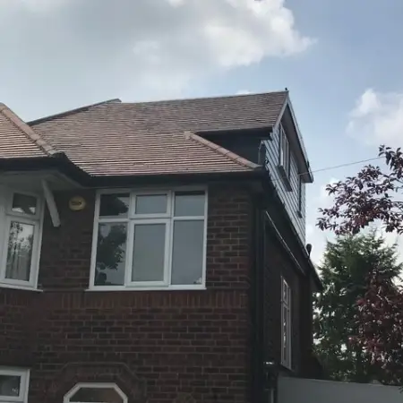 side pitch dormer with flat roof on a side of a property: Click Here To View Larger Image